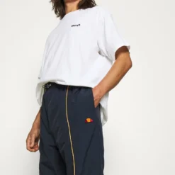 Ellesse ACER TRACK PANT - Pantalon Classique - Navy -Ellesse Elegant Boutique 48b54de80a7a4235967150b0cac76cac