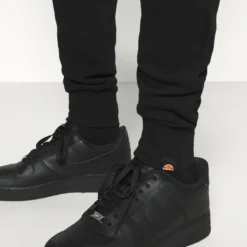 Ellesse GARNA - Pantalon De Survêtement - Black -Ellesse Elegant Boutique 6c1462ff65194c2e86b01bcf330c81e7