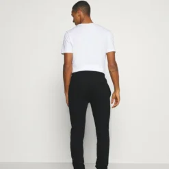 Ellesse GARNA - Pantalon De Survêtement - Black -Ellesse Elegant Boutique 7f0558037e9649e4a65e5f7f92245d39
